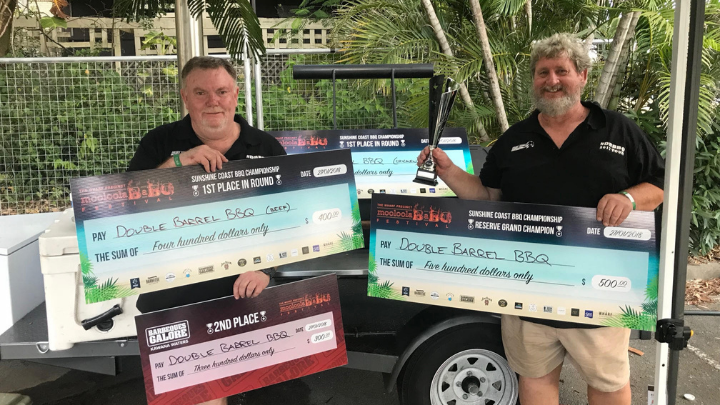 Adrian and Neil from Double Barrell BBQ holding their prize cheques